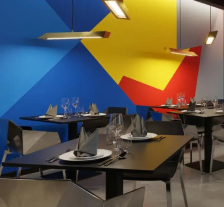 Kubistyczne wnętrze restauracji Zagrywka Zone z geometrycznym oświetleniem i kolorowymi bryłami